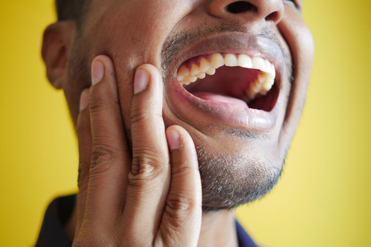 Understanding Tooth Sensitivity: Causes and Remedies